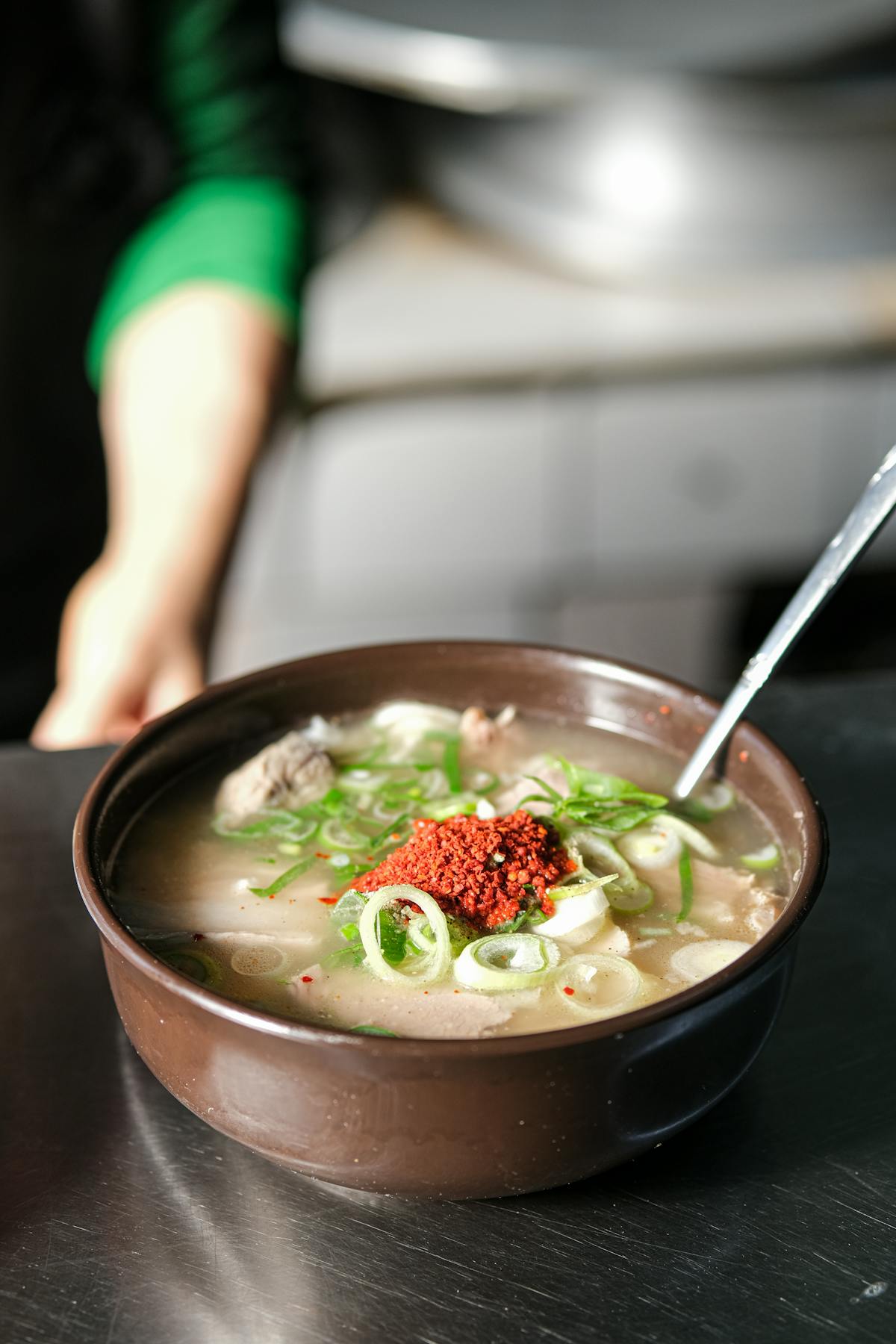 Korean seolleongtang milky bone broth soup with sliced beef and spring onions