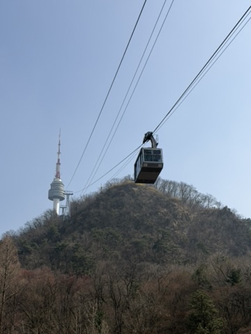 Namsan Cable Car with N Seoul Tower in the background