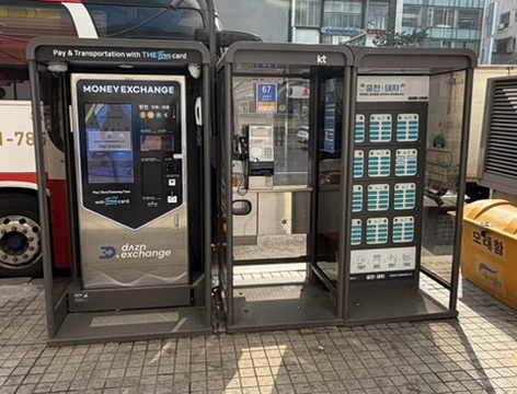 Money exchange and phone charging kiosks on Myeongdong street